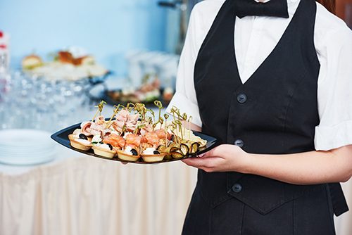 Worldwide Food Service Safety Month waitress serving food