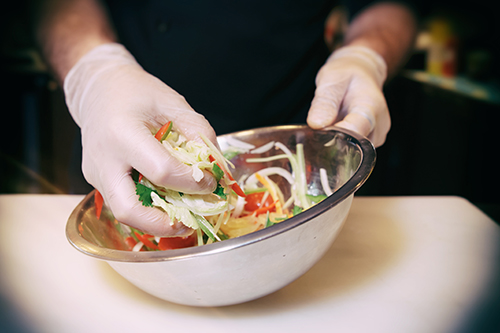 Worldwide Food Service Safety Month: Chef preparing a vegetarian salad
