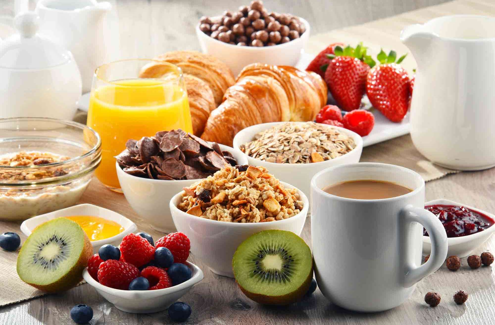 healthy breakfast fruit, coffee, croissant, oatmeal, heart-healthy