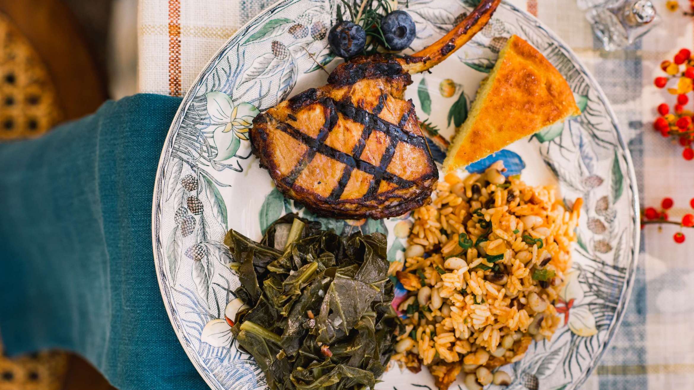 picture of beautiful Coastal Carolinas cuisine plated includes collards, golden rice, lamb shank and corn bread Salthouse Catering in Charleston, South Carolina