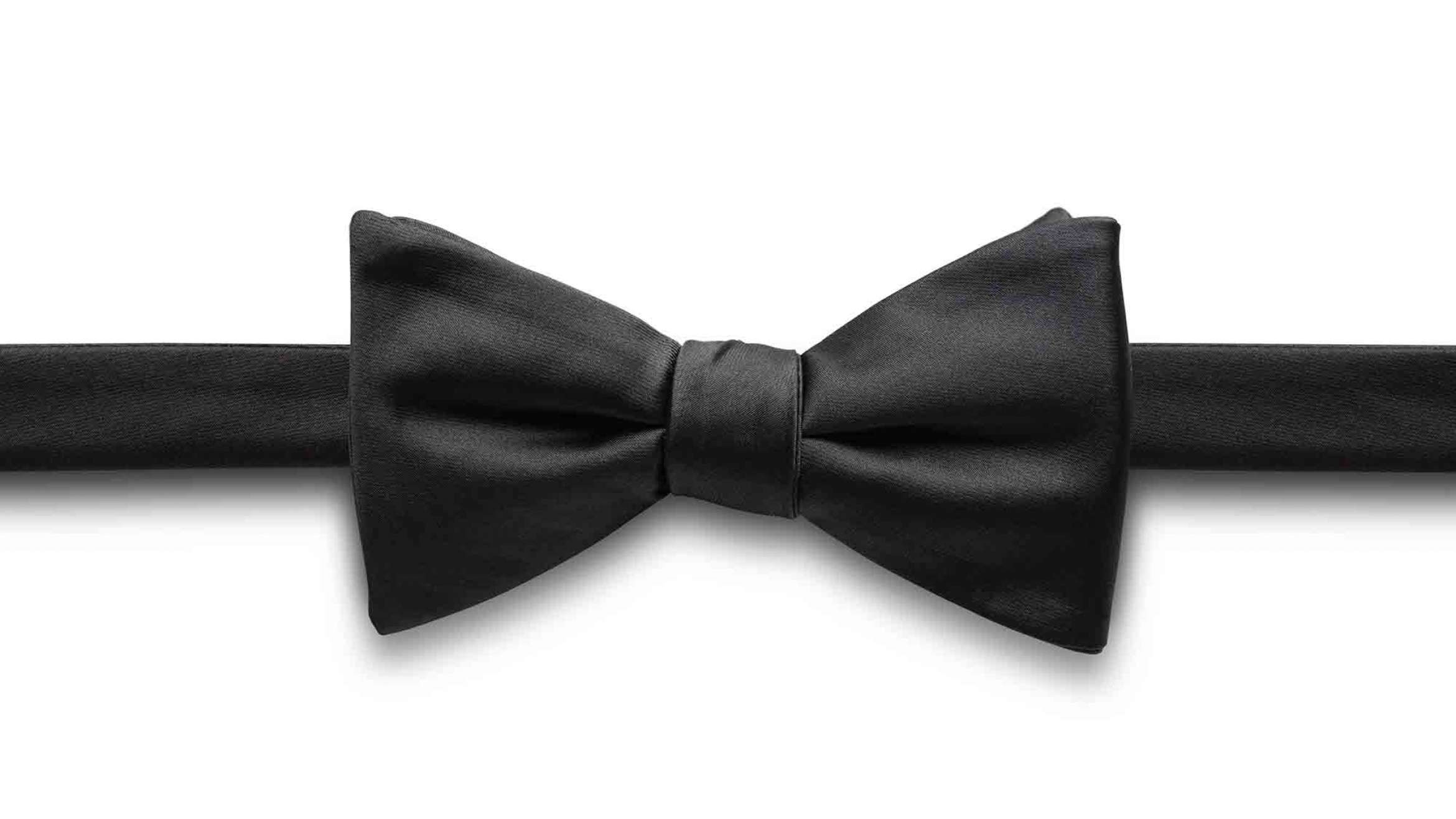 black bow tie on a white background to describe black tie service levels