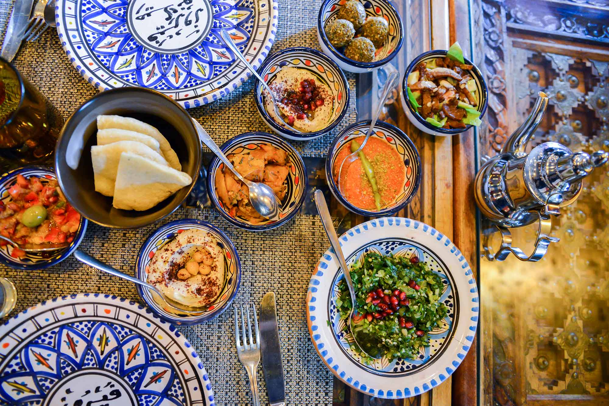 Middle eastern or arabic dishes and assorted meze, concrete rustic background food serves as a tool for welcome