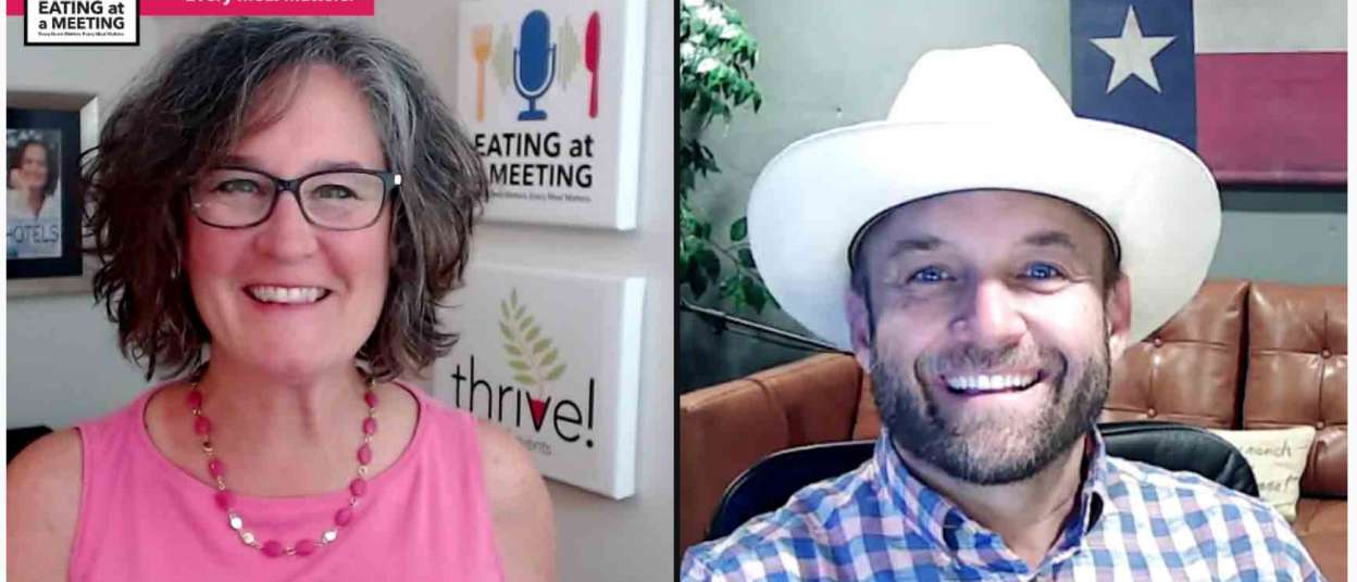 Two smiling people on video screen. The woman on the right is wearing a pink top. The man on the right is where a cowboy hat and the Texas flag is hanging on the wall behind him