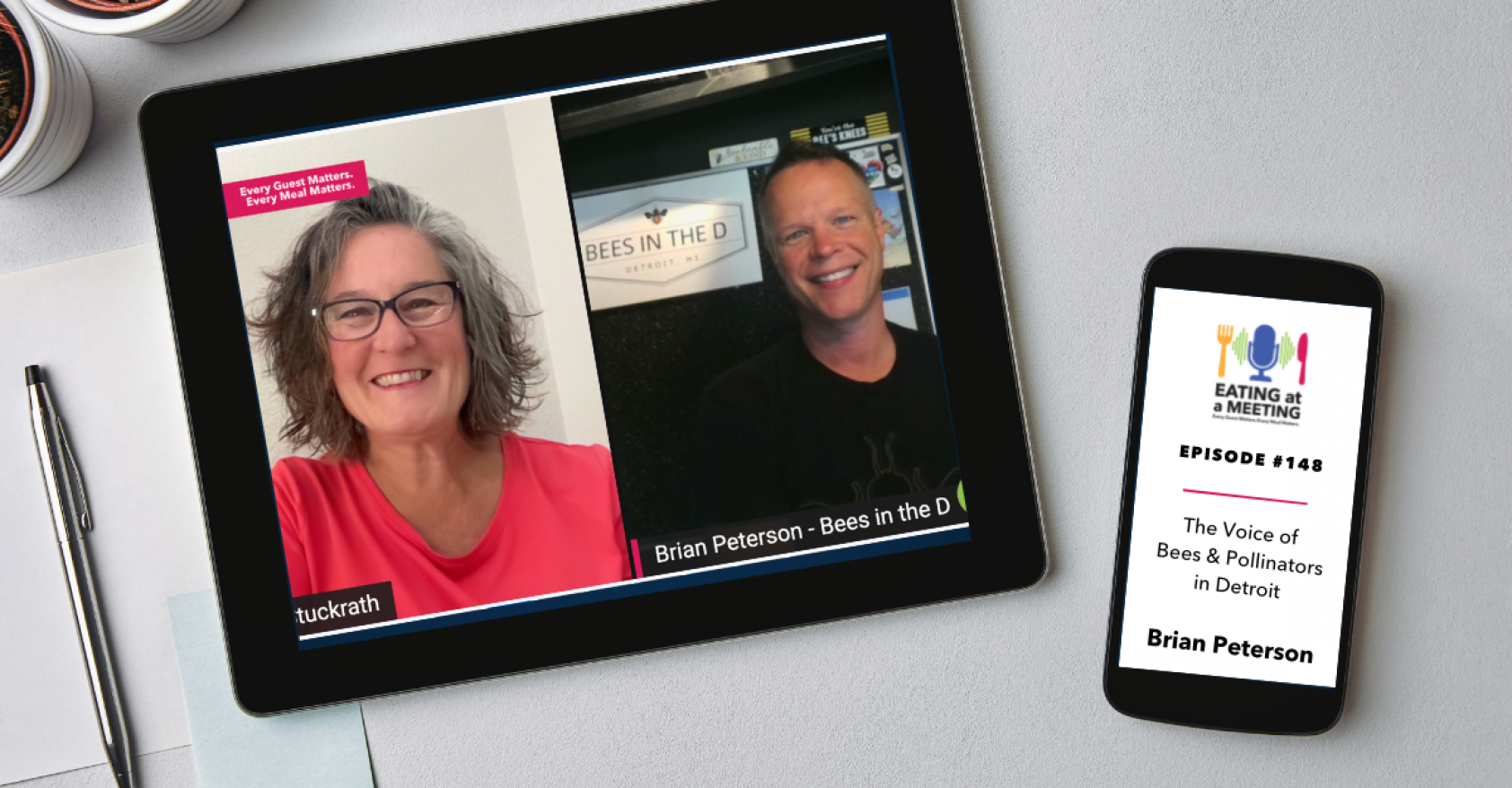 An iPad and iPhone on a table. On the iPad is a picture of two women who are on video screen. On the iphone is the Eating at a Meeting podcast logo with Episode #147 Learning to Use the 5 Dimensions of Wellbeing with Brian Peterson Bees in the D