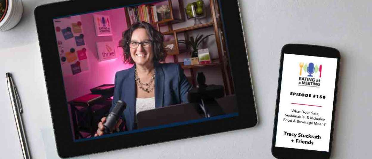 An iPad and iPhone on a table. On the iPad is a picture of a woman who are on video screen. On the iphone is the Eating at a Meeting podcast logo with Episode #150 What Does Safe Sustainable & Inclusive Food & Beverage Mean? Tracy Stuckrath + Friends