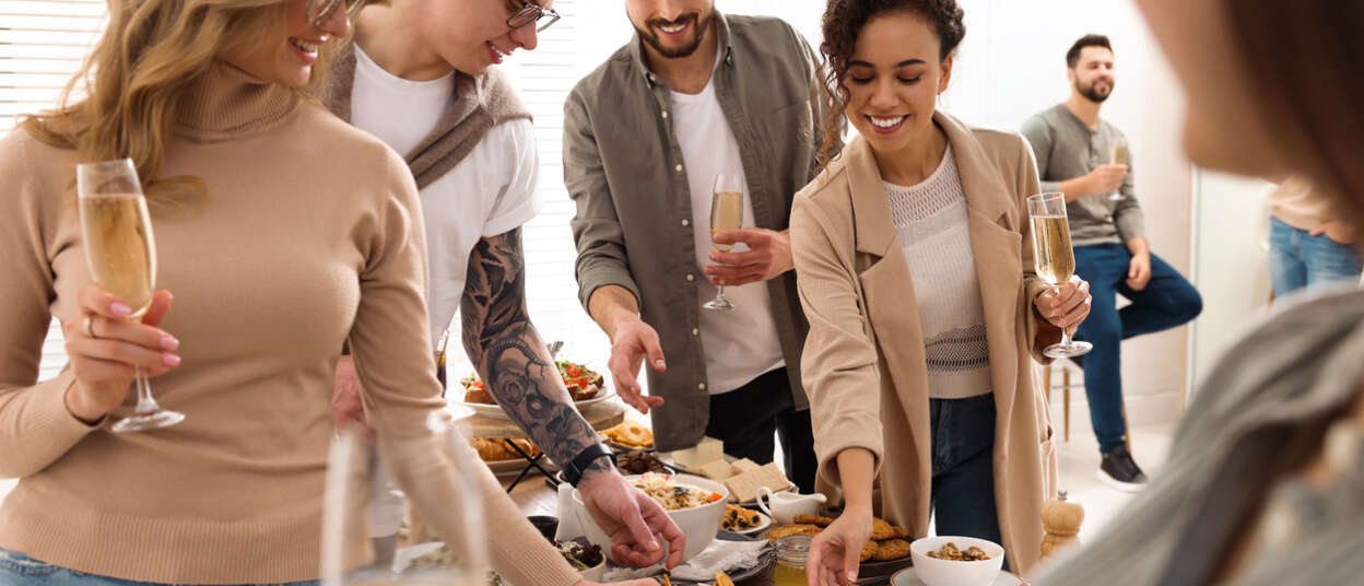 Group of people enjoying brunch buffet together indoors Event Safety at Events